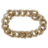 A 9ct gold faceted curb link bracelet, on a snap clasp, length 18.7cm, weight 43.3 gms.