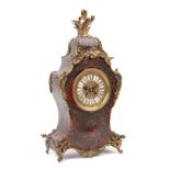 A French boulle work mantel clock, late 19th century, with brass dial and enamel Roman numerals,