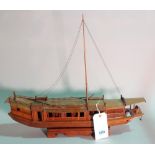 A modern hardwood model of a Chinese Junk, 63cm wide x 53cm high.