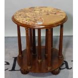 An early 20th century stained beech marble topped circular revolving side table, on fluted supports,
