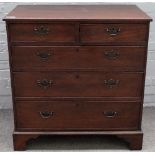 A mid-18th century oak chest, with two short over three long graduated drawers, on bracket feet,