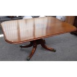 A George III mahogany rectangular snap top supper table, on four down swept supports,