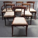 A set of seven Regency brass inlaid mahogany and rosewood dining chairs,