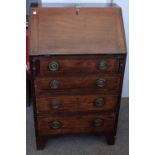 A small George III mahogany bureau, the fitted interior over four drawers on bracket feet,