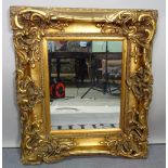 A modern gilt framed rectangular wall mirror, 71cm wide x 84cm high.