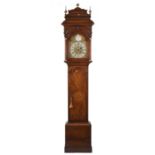 A Victorian mahogany longcase clock by Nehemiah Richardson, with foliate embellished arch top dial,