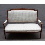 A Louis XVI style stained beech openarm sofa, on tapering fluted supports, 129cm wide x 101cm high.