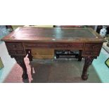 A Victorian mahogany writing desk, with three frieze drawers on cabriole supports,