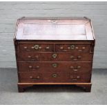 A mid-18th century oak bureau,