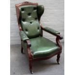 A Victorian mahogany framed green leather detachable wingback open armchair,