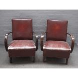 Czech Halabala, a pair of mid-20th century openarm easy chairs, on block supports,