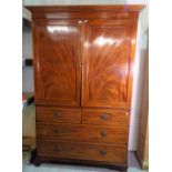 A George III style inlaid mahogany linen press,