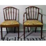 A set of six George III mahogany stick back dining chairs, to include one carver,