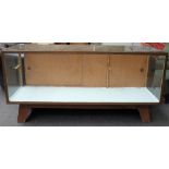 A mid 20th century bronze framed rectangular show case, on splayed block feet,