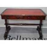 A late Victorian mahogany writing desk, with two frieze drawers and a tooled leather top,