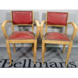 A matched set of six mid-20th century beech and studded leather open armchairs,