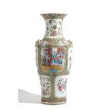 A large Canton famille-rose vase, 19th, of baluster form set with lion mask and ring handles,