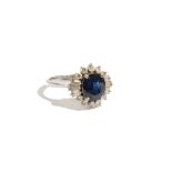 A 14ct white gold, sapphire and diamond-set ring of cluster design,