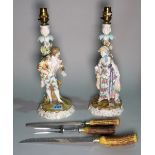 A pair of early 20th century continental ceramic figural table lamps, 38cm high,