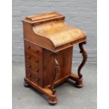 A Victorian figured walnut piano top pop up davenport, with four side drawers and scroll supports,
