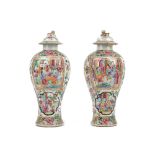 A pair of Canton famille-rose vases and covers, 19th century, of baluster form,