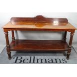 A late George III and later mahogany two tier buffet, on fluted tapering supports,