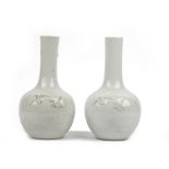 A pair of Chinese white-glazed bottle vases, late 19th/20th century,