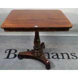 A 19th century mahogany rectangular side table, with turned column and trefoil base,
