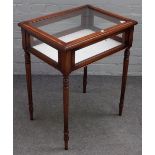 An Edwardian satinwood banded mahogany bijouterie table, on fluted turned supports,