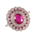 A ruby and diamond ring, mounted with the principal cushion shaped ruby to the centre,