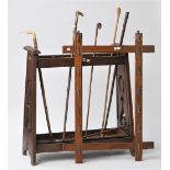 An early 20th century oak stick stand of Arts and Crafts style, 74cm high,