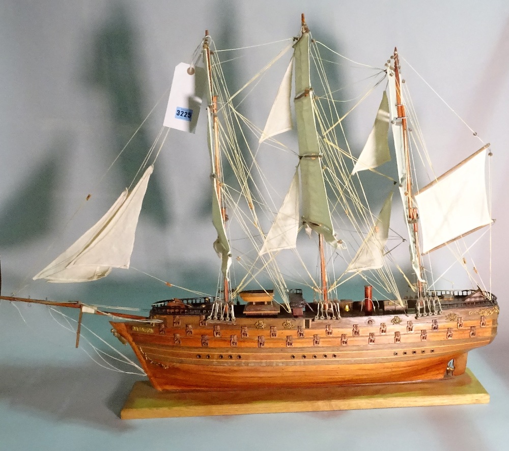 A modern wooden model of a triple mast galleon, 80cm wide x 78cm high.
