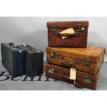 A collection of five 20th century suitcases and cases, mostly leather, various sizes,