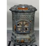SIMPLEX, an early 20th century French cast iron enamelled chapel stove, 45cm wide x 60cm high.