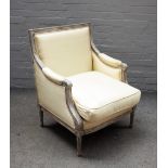 A Louis XVI style distressed grey painted square back armchair, on fluted supports,