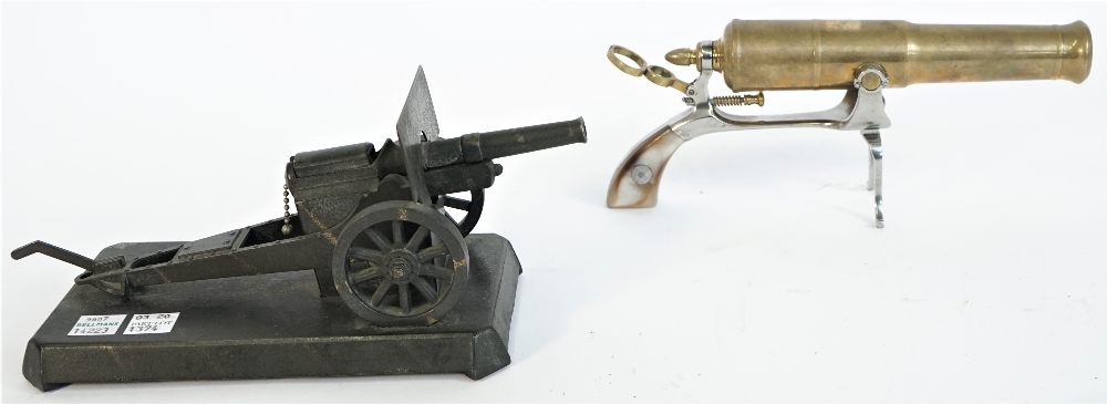 A brass novelty canon model on an iron pistol gripped frame, 20th century,