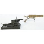 A brass novelty canon model on an iron pistol gripped frame, 20th century,