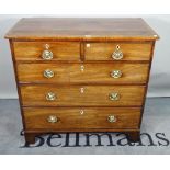 A George III mahogany chest of two short and three long graduated drawers on bracket feet,