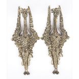 A pair of 19th century gilt bronze wall appliques, cast in the form of an exotic bird,