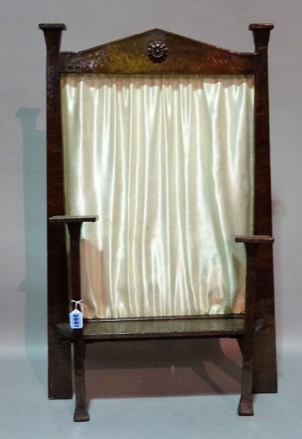 An Arts and Crafts copper covered wooden fire screen,