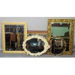 A group of four modern wall mirrors of various sizes, the largest 58cm wide x 81cm high,