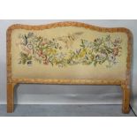 A mid-20th century carved oak and floral upholstered double headboard, 166cm wide x 119cm high.