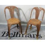 A pair of 20th century steel side chairs.