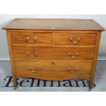 An early 20th century mahogany chest of two short and two long drawers on tapering supports,