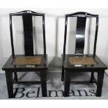 A set of four modern black lacquer Chinese chairs, 56cm wide x 115cm high.