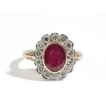 An 18ct gold, ruby and diamond oval cluster ring,