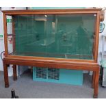 A mahogany framed rectangular trophy cabinet, on stand, 220cm wide x 190cm high.
