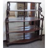 A 19th century Anglo-Portuguese mahogany mirror back display shelf, on five serpentine tiers,