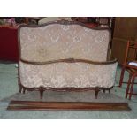 A French stained beech upholstered double bed, 146cm wide x 113cm high.