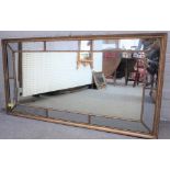 A 19th century gilt framed rectangular marginal mirror, 136cm wide x 76cm high.